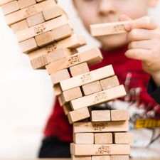 Boy playing jenga