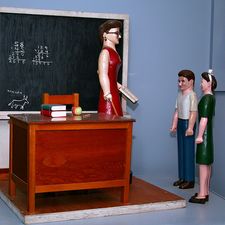 classroom with three figures